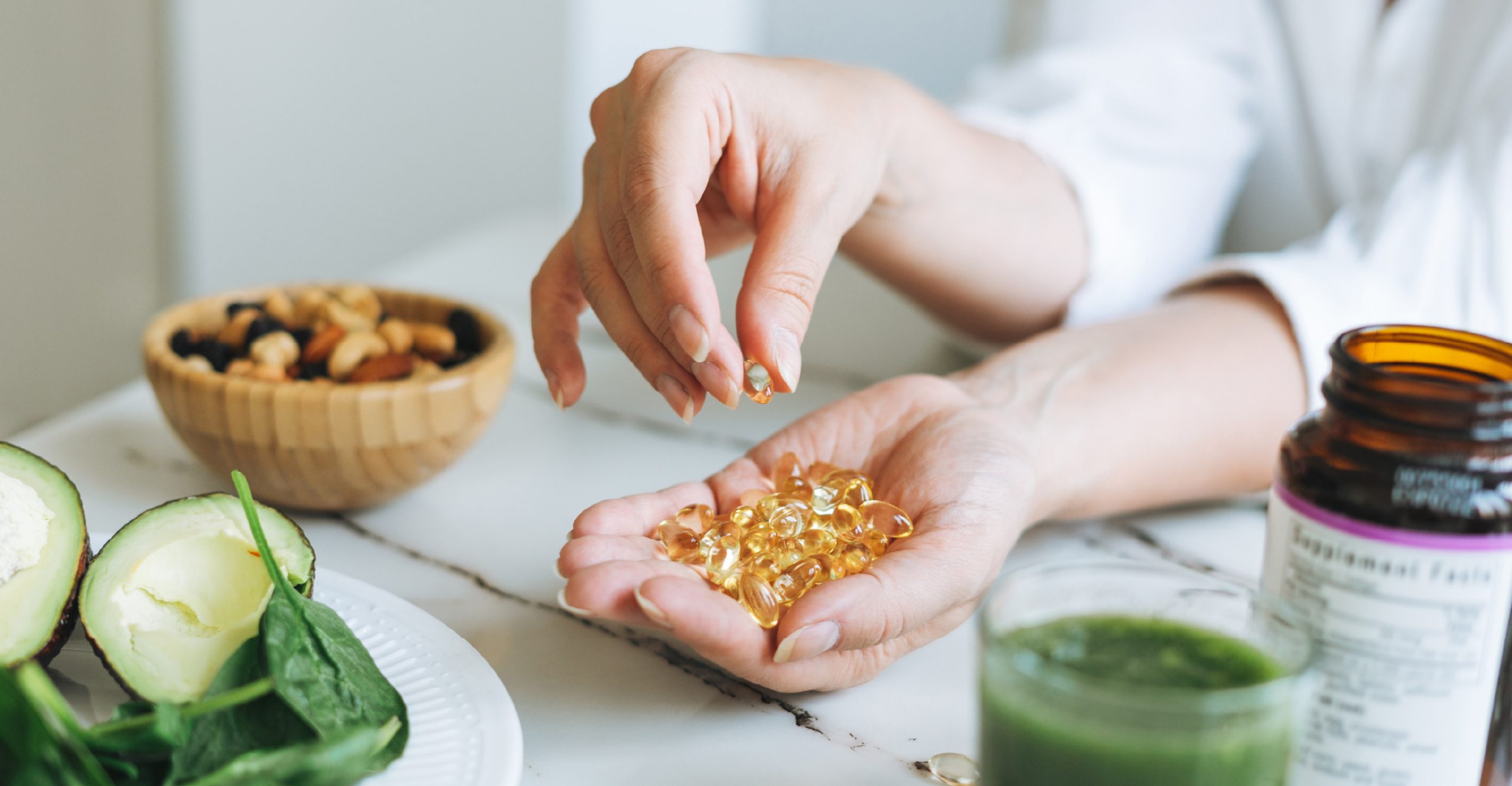 woman with vitamins in her hand