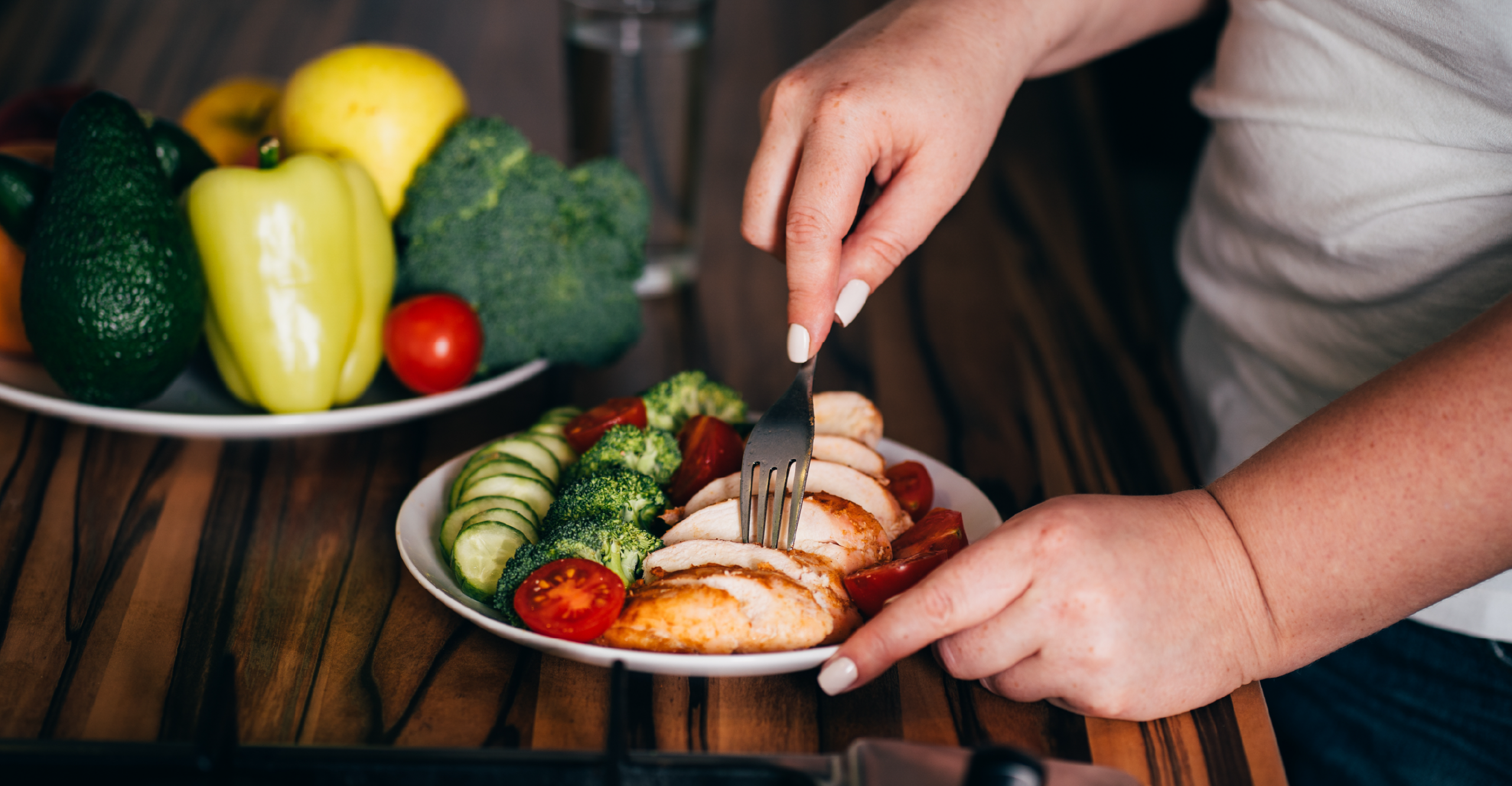 woman eating grilled chicken